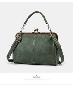 Detailed rear view of dark green matte leather vintage satchel bag with hardware