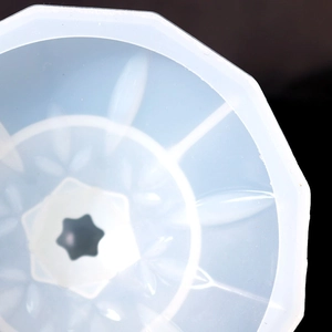 Detailed macro view of an octagonal resin silicone mold featuring intricate star patterns
