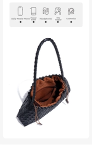 Interior view of black woven shoulder bag with drawstring closure and brown lining