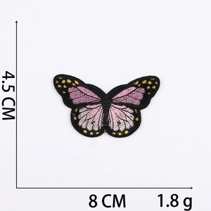 Detail view of pink butterfly embroidery patch with size markers 8 CM x 4.5 CM