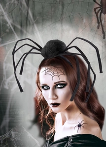 Detail of Halloween black spider headband with fuzzy legs worn by a model in spooky makeup
