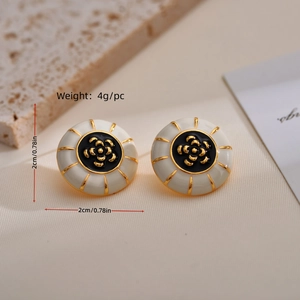 Minimalist white enamel camellia flower stud earrings with gold finish and vintage design