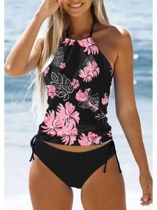 Women's halter tankini with pink floral print and side-tie black bikini bottom