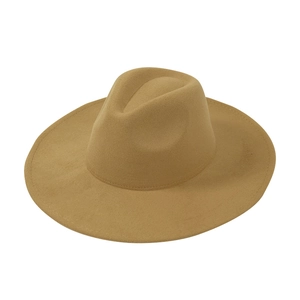 Macro detail of camel wool fedora showing smooth felt texture and classic indented crown