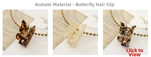 Detailed set of butterfly acetate hair claws in tortoise shell and cream shell finishes