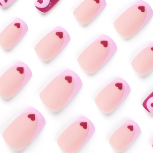 Pink French square press-on nails featuring red heart accents and a sweet aesthetic