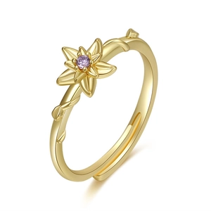 Detailed view of adjustable gold flower ring with a centered purple round zircon stone