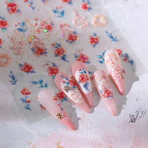 3D embossed nail stickers featuring red roses and serpent motifs on gradient pink nails