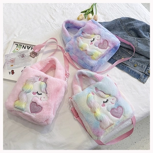 Detailed flat lay of plush unicorn handbags with soft faux fur and rainbow embroidery