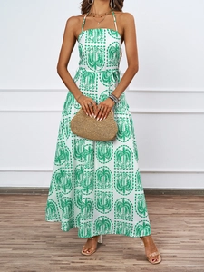 Summer halter maxi dress with palm leaf print and backless detail for beach vacation