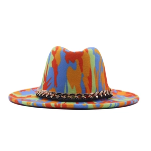 Detail shot of a graffiti fedora hat with colorful camouflage and gold chain trim