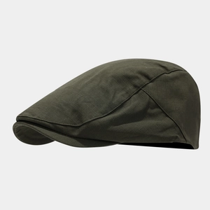 Detailed close-up of dark green quick-dry flat cap showing high-density cotton twill texture