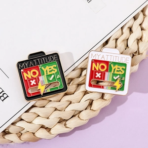Detail of sliding enamel mood pin showing black and white My Attitude design