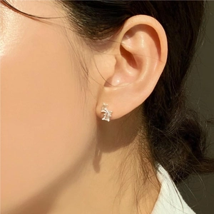 Close-up of minimalist S925 sterling silver square zircon earrings on woman ear