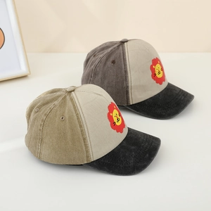 Kids color-block washed baseball cap featuring a cute cartoon lion print on cotton canvas