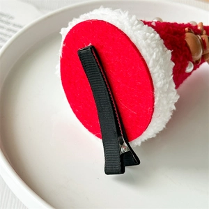 Christmas themed Santa hat hair clip with red felt and soft white faux fur trim