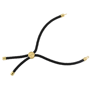 Close-up of black braided cord bracelet with adjustable gold slider and tree of life charm