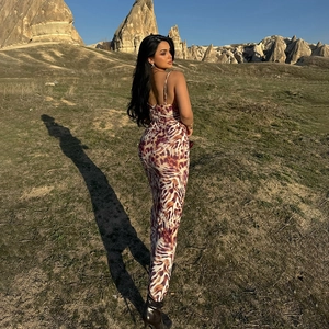 Detail shot of the backless maxi dress featuring a classic leopard print pattern