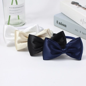 Set of four satin bow headbands in white, champagne gold, black, and navy blue
