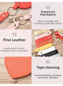 Detail of leather heart keychain with premium gold hardware and precise stitching
