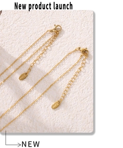Macro detail of 18K gold plated stainless steel necklace chain with S.steel engraving