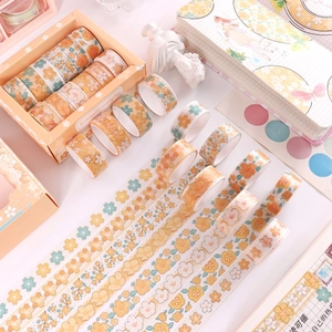 Pastel pink floral washi tape set with gold foil accents in decorative gift box