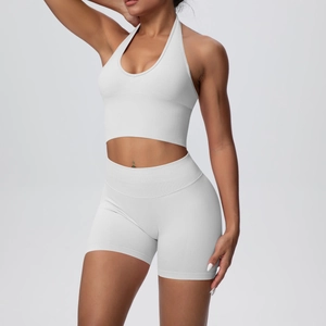 Detail view of seamless knit grey yoga set with halter bra and high-waist sports shorts