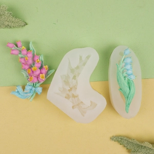Macro view of silicone tulip and lily molds with floral clay DIY craft samples