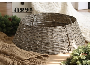 Close-up of hand-woven wicker Christmas tree stand base cover in rustic grey brown