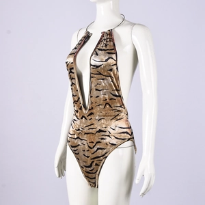 Detail of velvet tiger print bodysuit showing the deep V-neck and halter neckline texture