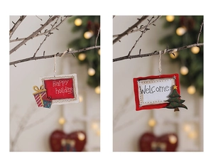 Detail of wooden Christmas pendants featuring Happy Holidays and Welcome festive greetings