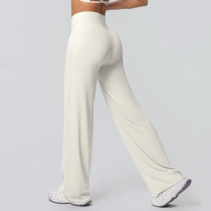 Detail view of high waisted wide leg yoga pants in cream white with breathable fabric