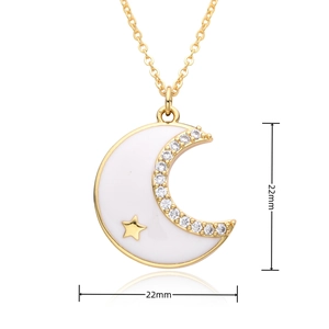 Macro detail of crescent moon pendant with white enamel and sparkling zircon stones