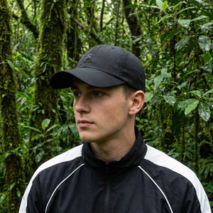 Men's summer black sun protection baseball cap with laser-cut S-shaped ventilation holes