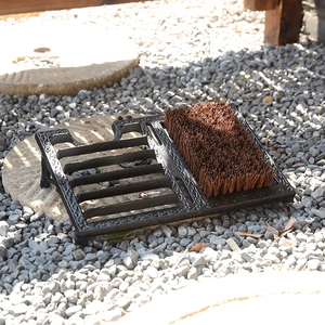 Vintage cast iron outdoor shoe scraper brush with heavy duty bristles for entryway
