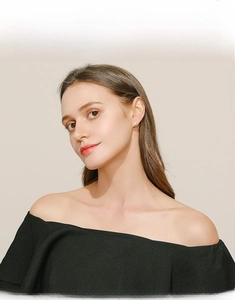 Close-up of minimalist S925 sterling silver marquise stud earrings worn by a model