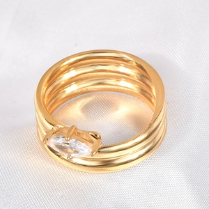 Multi-layer gold-plated titanium ring with marquise-cut zircon on white silk