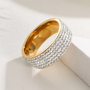 Macro shot of 8mm wide gold plated stainless steel ring with five rows of pavé diamonds