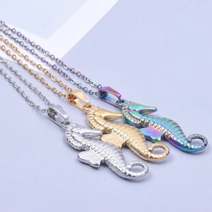Three seahorse pendant necklaces in silver, gold, and rainbow finish stainless steel
