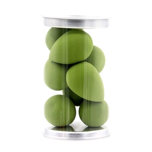 Detail view of mini teardrop makeup sponges in a clear jar with silver metal caps