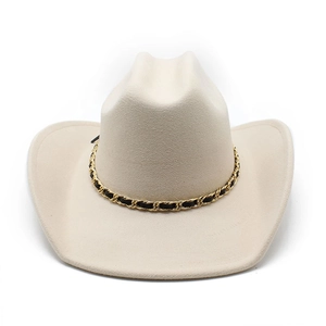 Close-up of beige wool cowboy hat with decorative gold metal chain and leather strap detail