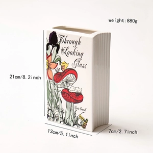 Detailed size specifications for the book-shaped ceramic vase featuring Alice illustrations