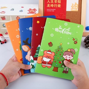 Set of four colorful A5 Christmas cartoon notebooks with bear and reindeer motifs