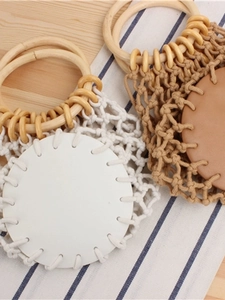 Handmade woven cotton mesh beach bag with round wooden handles in white and camel brown