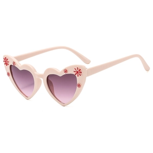Pink heart-shaped kids sunglasses with purple gradient lenses and floral details