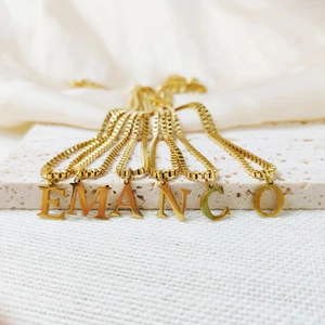 Elegant golden stainless steel box chain necklace featuring capital letter pendants