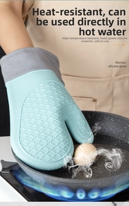 Waterproof silicone oven mitt picking eggs from boiling water with heat resistance