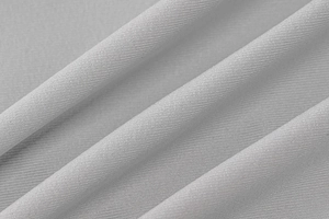 Détail macro du tissu en maille grise de haute qualité montrant la texture et le tissage
