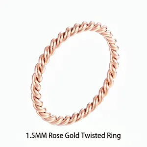 Macro detail of 1.5mm rose gold twisted rope ring in polished titanium steel
