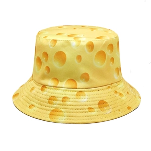 Bright yellow reversible bucket hat featuring a realistic creative Swiss cheese print design